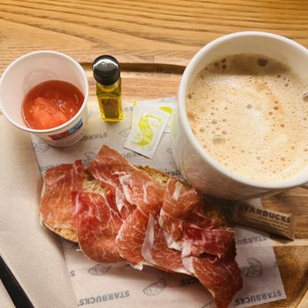 Starbucks - Toasted bread w/ tomato & jamón.. café con leche (almond) - Coffee & Tea Near Me - Granada, GR