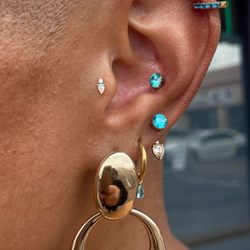 HTC Studios - Phoenix North - Tragus, conch, and earlobe piercings. Daydream and prong ends from Buddha Jewelry and NeoMetal