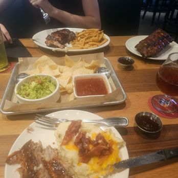 BJ's Restaurant & Brewhouse - Splitting the full  rack rib dinner, plenty with leftovers. - New American Near Me - Bakersfield, California