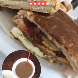 Panaderia El Delfin Dorado - Egg, Cheese, bacon and ham sandwich! About a footling cut into quarters!