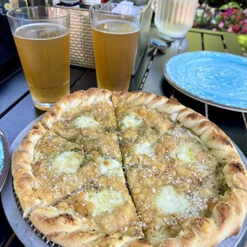 Ice House BBQ - Stone fired Blanco pizza and two Blueberry Lemonade Shandy beers on tap from a local brewery. - American Near Me - Mackinac Island, Michigan Ice House BBQ - Stone fired Blanco pizza and two Blueberry Lemonade Shandy beers on tap from a local brewery. - American Near Me - Mackinac Island, Michigan