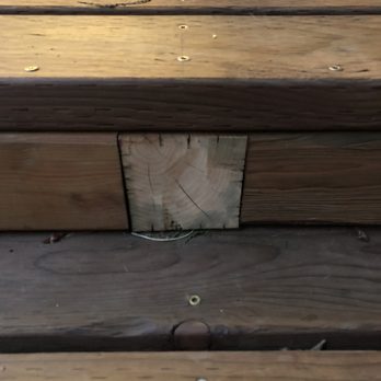 Marcus Construction & Development - a close up of a wooden bench - General Contractors Near Me