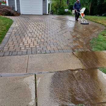 The Eagles Landscape - a man cleaning a driveway - Landscaping Near Me The Eagles Landscape - a man cleaning a driveway - Landscaping Near Me