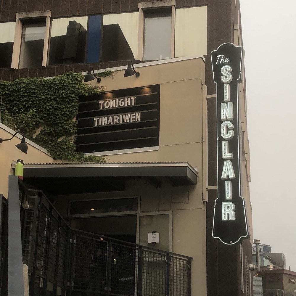 a tall building with a sign on it a tall building with a sign on it