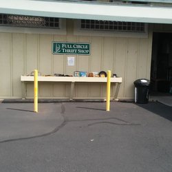 Full Circle Thrift Shop - Their free bin in front.  Entry is on the right.