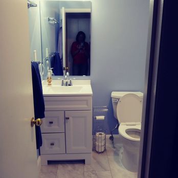 Property Doctor - a bathroom with a toilet and sink - General Contractors Near Me Property Doctor - a bathroom with a toilet and sink - General Contractors Near Me