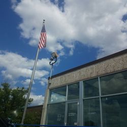 United States Post Office - The star  spangled banner flies high carrying the mail near &  far