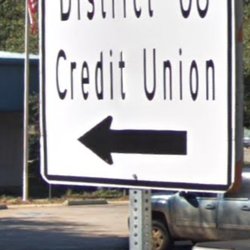District 8 Federal Credit Union - "Turn here for the credit union" sign.