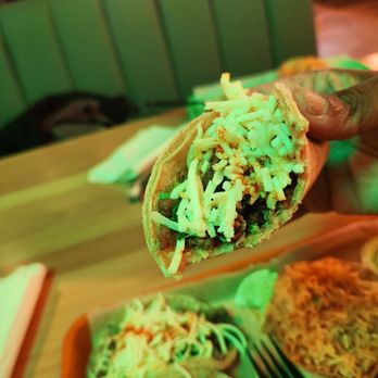Taco Pros - Showing a bite from the Steak Taco - Mexican Near Me - Dyer, Indiana