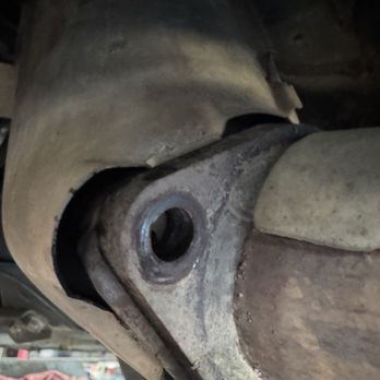 Eagle Transmission North Austin - Missing exhaust bolt after clutch installation. This kind of oversight can lead to additional costly repairs if left unaddressed. - Transmission Repair Near Me - Austin, Texas