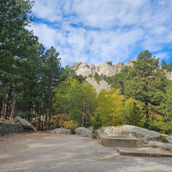 Mount Rushmore National Memorial - Scenic view of Mount Rushmore on the trail - Landmarks & Historical Buildings Near Me - Keystone, South Dakota