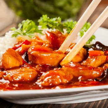 Hot Wok Cafe - a plate of food with chopsticks - Chinese Near Me - Calgary, Alberta Hot Wok Cafe - a plate of food with chopsticks - Chinese Near Me - Calgary, Alberta