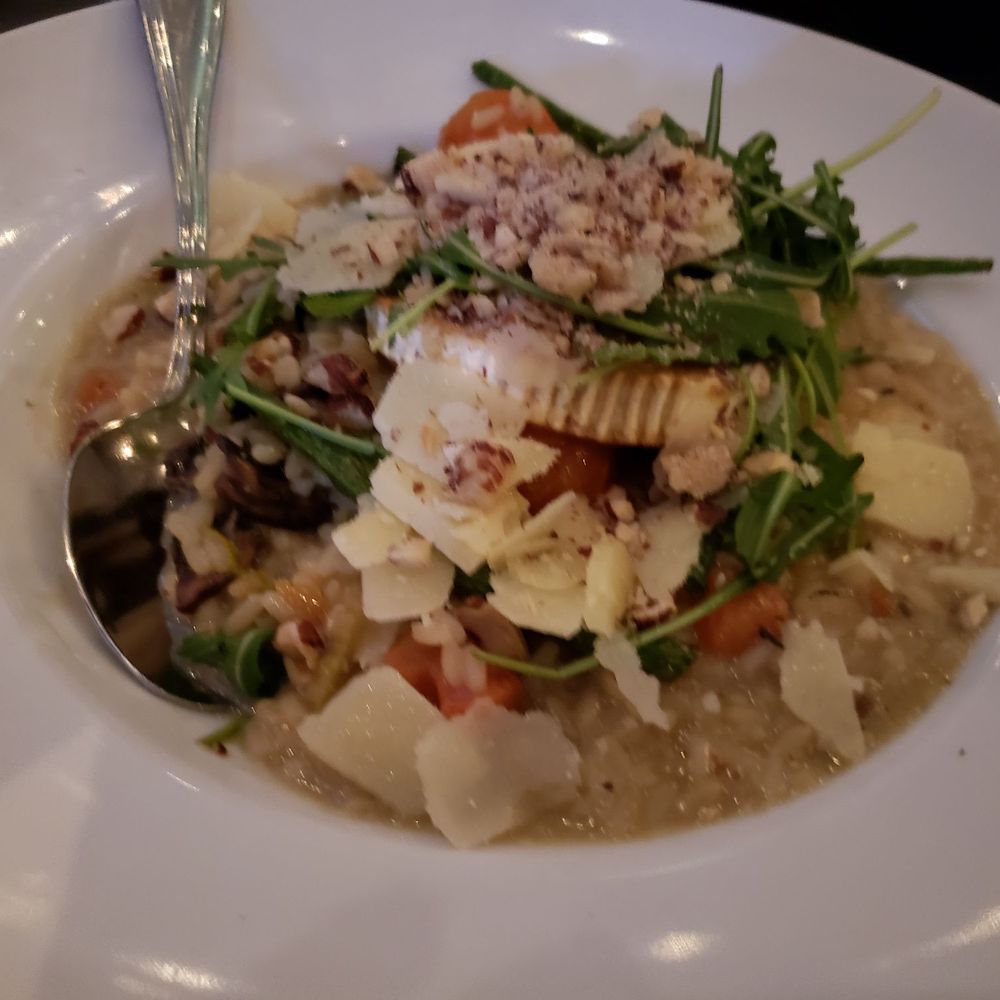 Mushroom risotto with chevre, arugula, and hazelnuts Mushroom risotto with chevre, arugula, and hazelnuts