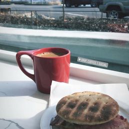 Drip coffee and a breakfast sandwich