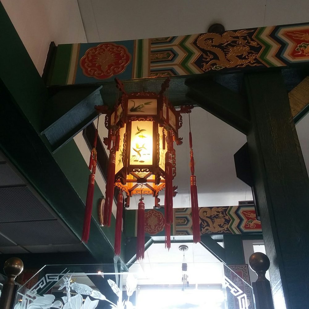 a chinese lantern hanging from the ceiling a chinese lantern hanging from the ceiling