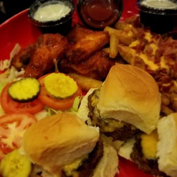 Movie Tavern Covington - Game day platter (six wings, three sliders, and fries topped with bacon and cheese) - Cinema Near Me - Covington, Louisiana Movie Tavern Covington - Game day platter (six wings, three sliders, and fries topped with bacon and cheese) - Cinema Near Me - Covington, Louisiana