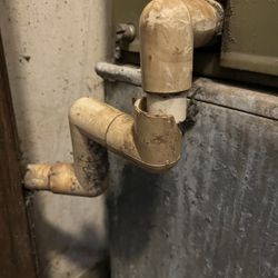 Nhs Property Management - Old pipes for a condenser