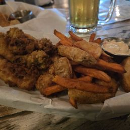 Sweet potato and regular fries, fish, oysters and shrimp mix basket Sweet potato and regular fries, fish, oysters and shrimp mix basket