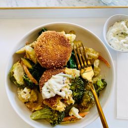 Artichoke cakes, roasted vegetables and creamy dill sauce. (Vegan and gluten-free) Artichoke cakes, roasted vegetables and creamy dill sauce. (Vegan and gluten-free)