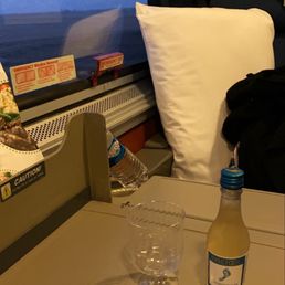 Sleeper car with a complimentary drink.