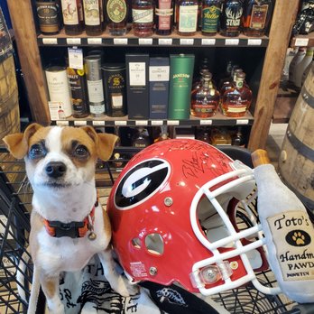The Oconee Cellar - a dog in a shopping cart with a football helmet - Beer, Wine & Spirits Near Me - Greensboro, Georgia The Oconee Cellar - a dog in a shopping cart with a football helmet - Beer, Wine & Spirits Near Me - Greensboro, Georgia