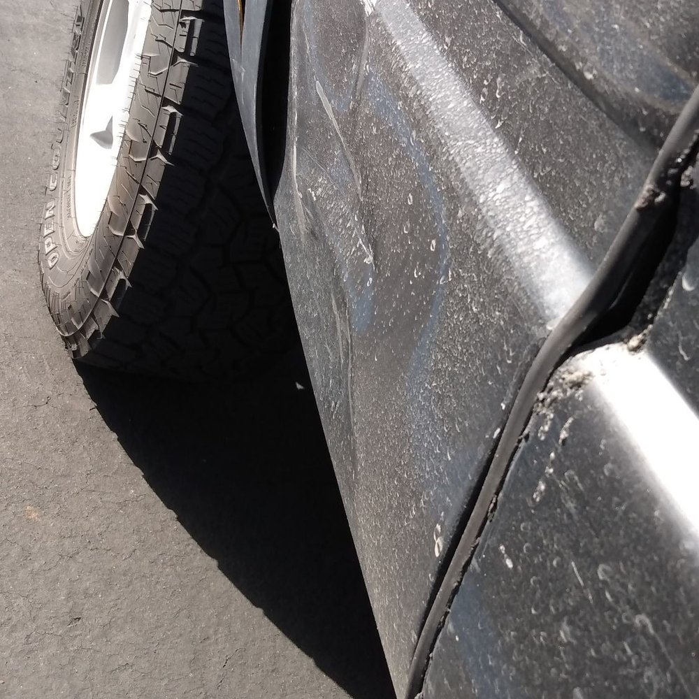 ROI Motors Burbank - Dent by my passenger side rear tire before repair. - Body Shops Near Me - Burbank, California ROI Motors Burbank - Dent by my passenger side rear tire before repair. - Body Shops Near Me - Burbank, California