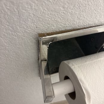 The Block Hotel - Toilet paper dispenser from the 70s falling out of the wall - Hotels Near Me - Bentonville, Arkansas The Block Hotel - Toilet paper dispenser from the 70s falling out of the wall - Hotels Near Me - Bentonville, Arkansas