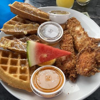 Palace Bar - Chicken & Waffles - buttermilk waffles, crispy fried chicken, sided with fruit, maple syrup, and honey hot sauce - Gay Bars Near Me - Miami Beach, Florida Palace Bar - Chicken & Waffles - buttermilk waffles, crispy fried chicken, sided with fruit, maple syrup, and honey hot sauce - Gay Bars Near Me - Miami Beach, Florida