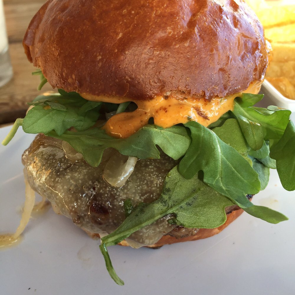 Uneeda Burger - Medi-Terra... lamb burger with charred peppers and onions, manchego, tempura lemons, arugula, cilantro... - Burgers Near Me - Seattle, Washington Uneeda Burger - Medi-Terra... lamb burger with charred peppers and onions, manchego, tempura lemons, arugula, cilantro... - Burgers Near Me - Seattle, Washington