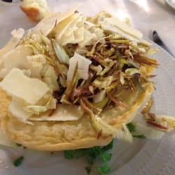 Rivalago - Artichoke salad, with Parmesan shavings in a Parmesan basket.