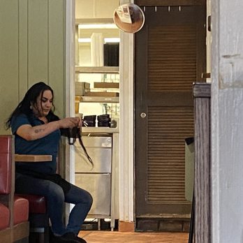 Chili's - A server/food runner grooming themselves in the restaurant seating area. - Bars Near Me - Rapid City, South Dakota