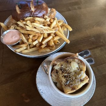 The Unicorn Tavern - Whole Scourmont Schnitzel with frites and small Belgian onion soup - Belgian Near Me - Grand Haven, Michigan