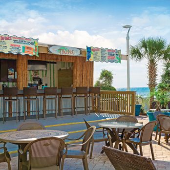 Paradise Resort - Sandals Café & Tiki Hut outdoor seating and bar - Resorts Near Me - Myrtle Beach, South Carolina Paradise Resort - Sandals Café & Tiki Hut outdoor seating and bar - Resorts Near Me - Myrtle Beach, South Carolina