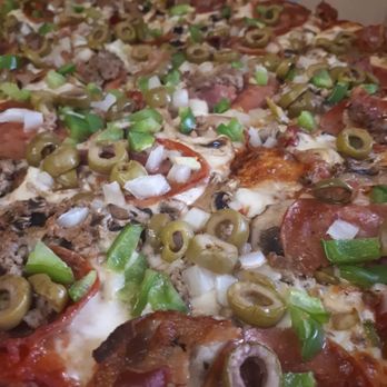 Bedrock Cafe - a pizza with pepperoni, sausage, and green olives - Pizza Near Me - Orillia, Ontario Bedrock Cafe - a pizza with pepperoni, sausage, and green olives - Pizza Near Me - Orillia, Ontario