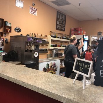 Bubbie's Snowballs - a man and a woman behind a counter - Desserts Near Me - Kenner, Louisiana