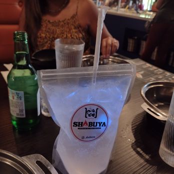 Shabuya - Lychee cocktail with color changing ice cube in a plastic that looks like it's hanging from an IV in a hospital - Hot Pot Near Me - Concord, California Shabuya - Lychee cocktail with color changing ice cube in a plastic that looks like it's hanging from an IV in a hospital - Hot Pot Near Me - Concord, California