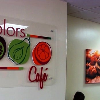 Colors Cafe - a woman sitting at a table - Cafeteria Near Me - San Diego, California Colors Cafe - a woman sitting at a table - Cafeteria Near Me - San Diego, California