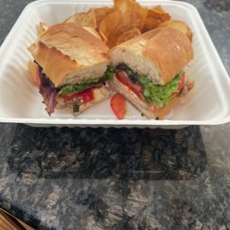 a sandwich and chips a sandwich and chips