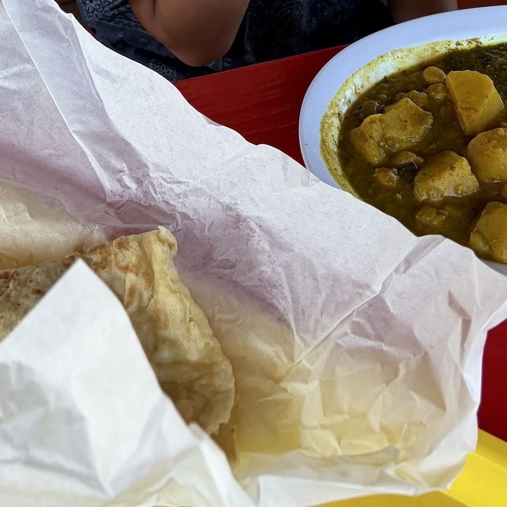 Caribbean Fusion Trini Style - Curry Goat Roti dinner.....Curry goat with chickpeas and potatoes. - Caribbean Near Me - Bethany, Oklahoma Caribbean Fusion Trini Style - Curry Goat Roti dinner.....Curry goat with chickpeas and potatoes. - Caribbean Near Me - Bethany, Oklahoma