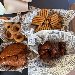 Three piece tender, piece wings, waffle fries, and onion rings