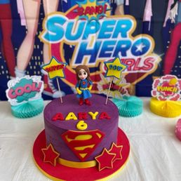 Super girl themed vanilla strawberry cake!! Super girl themed vanilla strawberry cake!!