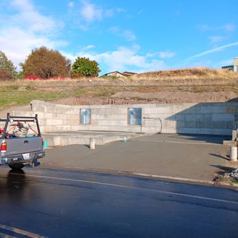 Eighty Three Excavation - a concrete wall and a road - Excavation Services Near Me Eighty Three Excavation - a concrete wall and a road - Excavation Services Near Me