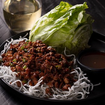 P.F. Chang's - a plate of noodles and lettuce - Asian Fusion Near Me - Baton Rouge, Louisiana P.F. Chang's - a plate of noodles and lettuce - Asian Fusion Near Me - Baton Rouge, Louisiana