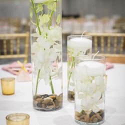 Christopher's Flowers - Classic white orchids with floating candles.
