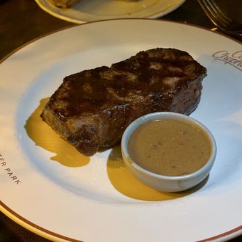 Corner Chophouse - 14oz NY strip with au poivre sauce - Steakhouses Near Me - Winter Park, Florida Corner Chophouse - 14oz NY strip with au poivre sauce - Steakhouses Near Me - Winter Park, Florida