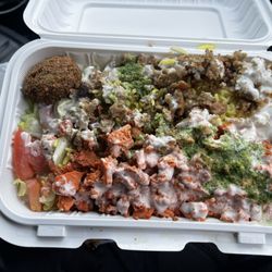 Two Guys - Combo platter ((already in the process to be eaten)) + 2 Pieces of Falafel ((half way eaten))