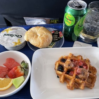 United Airlines - Waffle and fruit. Delicious!! Waffle was crispy outside, soft inside with slight glaze. 12/3/22 - Airlines Near Me - Indianapolis, Indiana