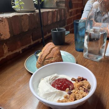 smallSUGAR - Yogurt and Granola Bowl with preserves. Homemade rosemary bread with green tahini spread (brilliant!) - Coffee & Tea Near Me - Columbia, South Carolina