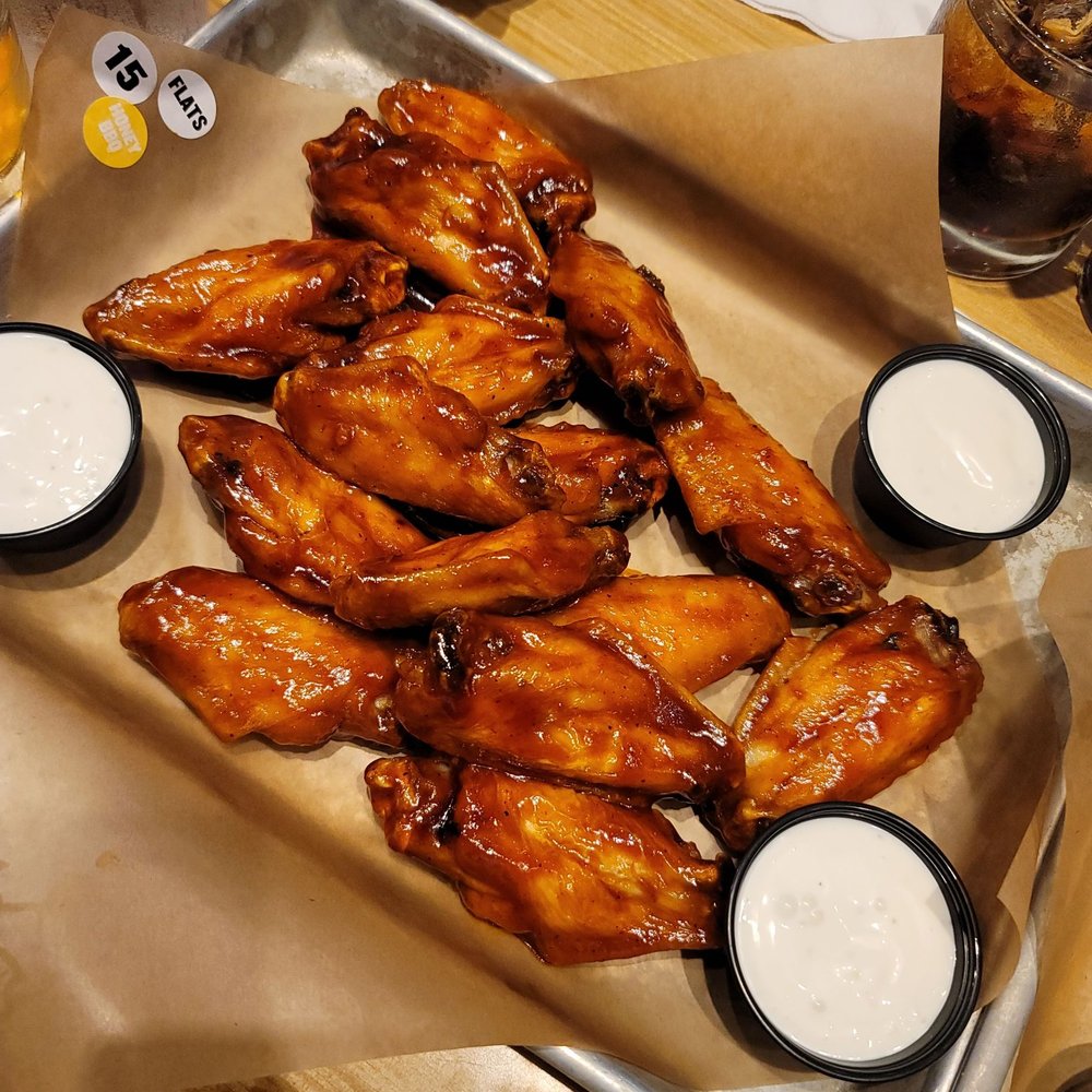 Buffalo Wild Wings - a platter of buffalo wings with dipping sauces - Sports Bars Near Me - Sumter, South Carolina