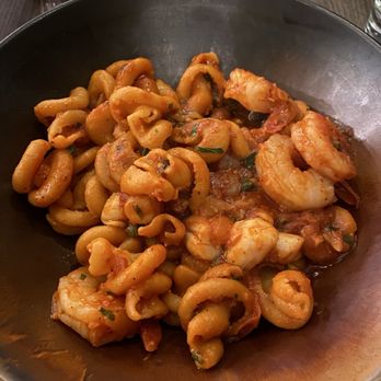 Trattoria by Italian Kitchen - Nodi marini fra diavolo. Didn't expect the tomato sauce as it said aglio olio in menu. Scallops, prawns and olives. - Italian Near Me - Burnaby, British Columbia
